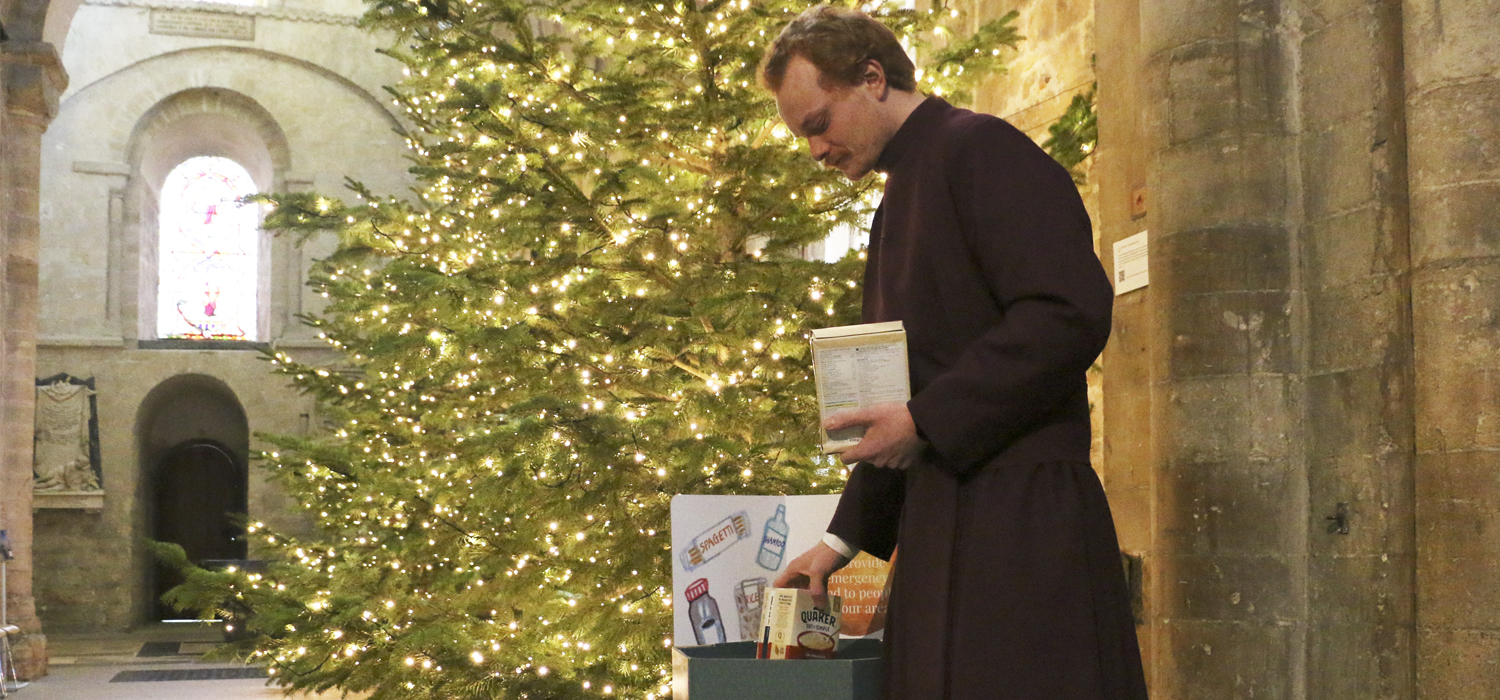 Verger Ben collects donations for the Foodbank